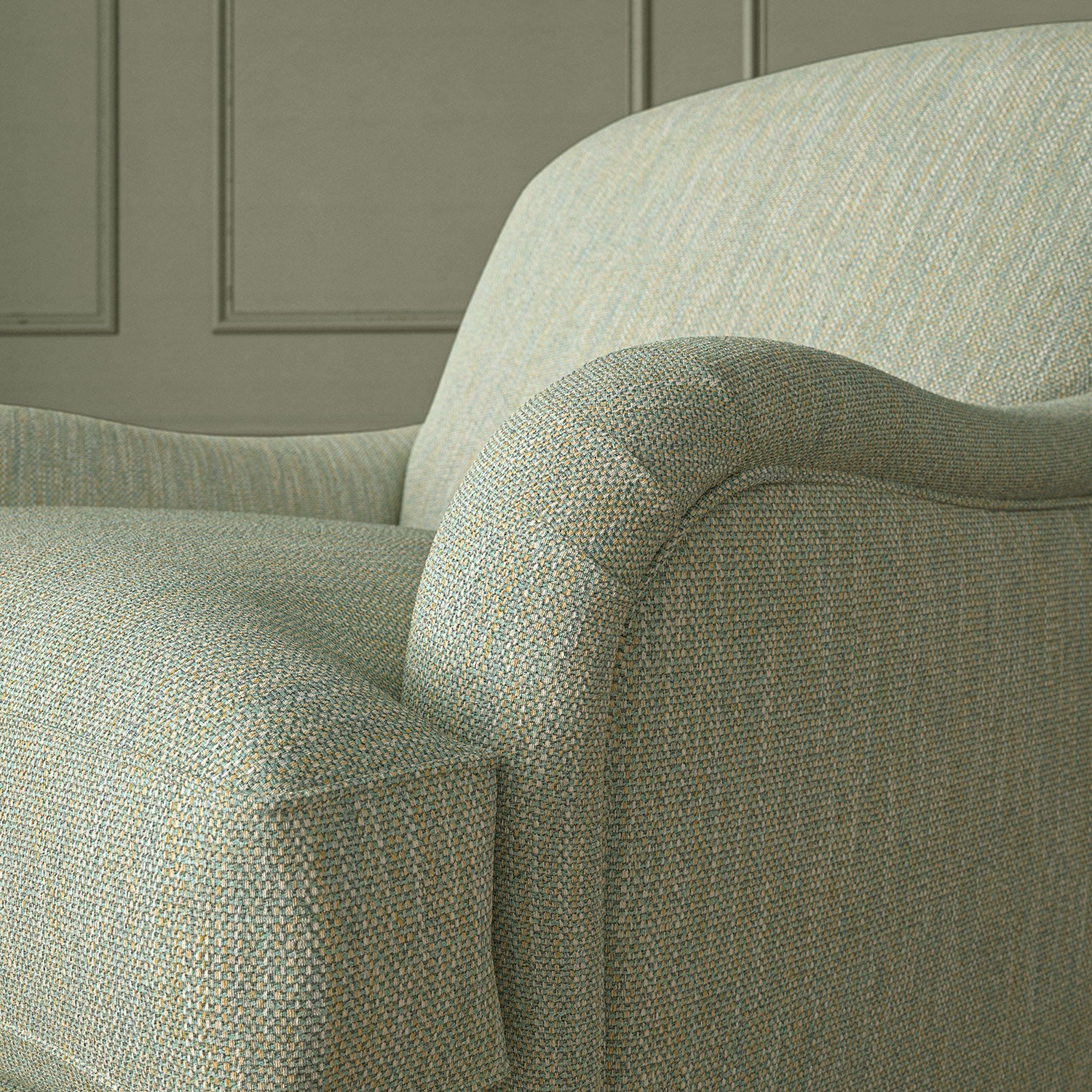 Close-up of armchair in Loxley Powder Blue by Linwood – durable, Italian-woven natural fibre fabric in muted blue.
