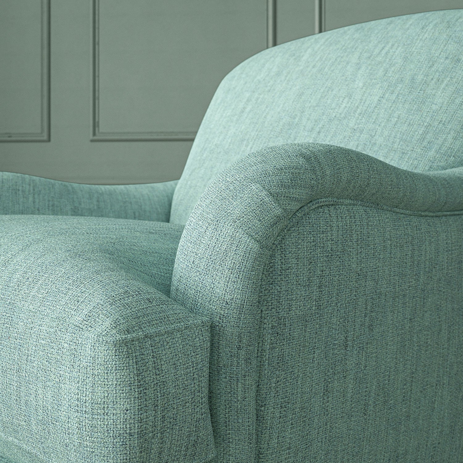 Close-up of armchair in Loxley Sky by Linwood – durable, Italian-woven natural fibre fabric in muted blue.