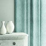 Curtain in Loxley Sky by Linwood – blue Italian-woven fabric with rich texture and depth.