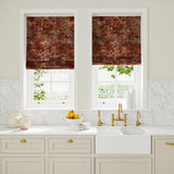 Blinds made from a printed velvet fabric in red and brown featuring a classic distressed pattern.