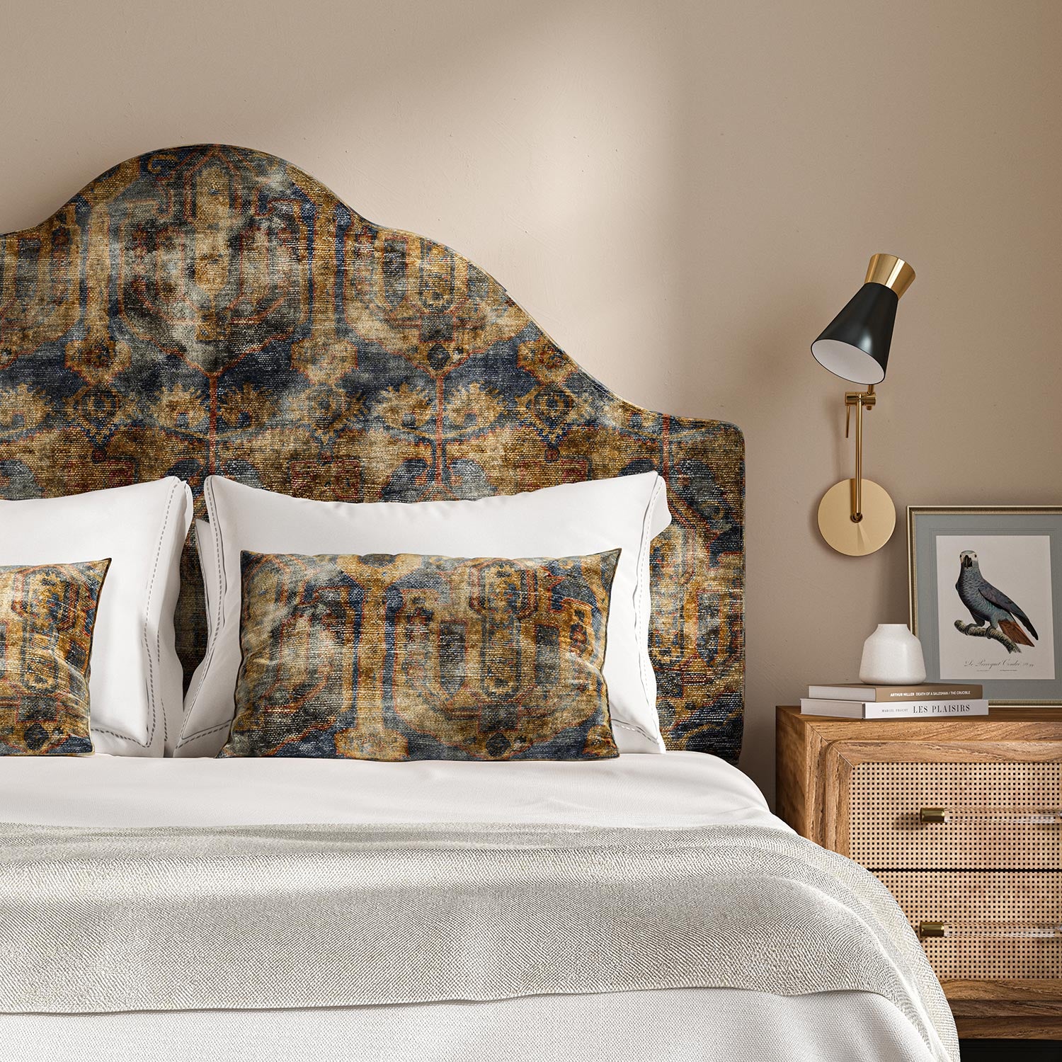 Headboard upholstered in a printed velvet fabric in blue, brown and black featuring an opulent pattern.