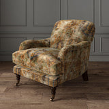 Armchair upholstered in a printed velvet fabric in brown and black featuring an opulent pattern.