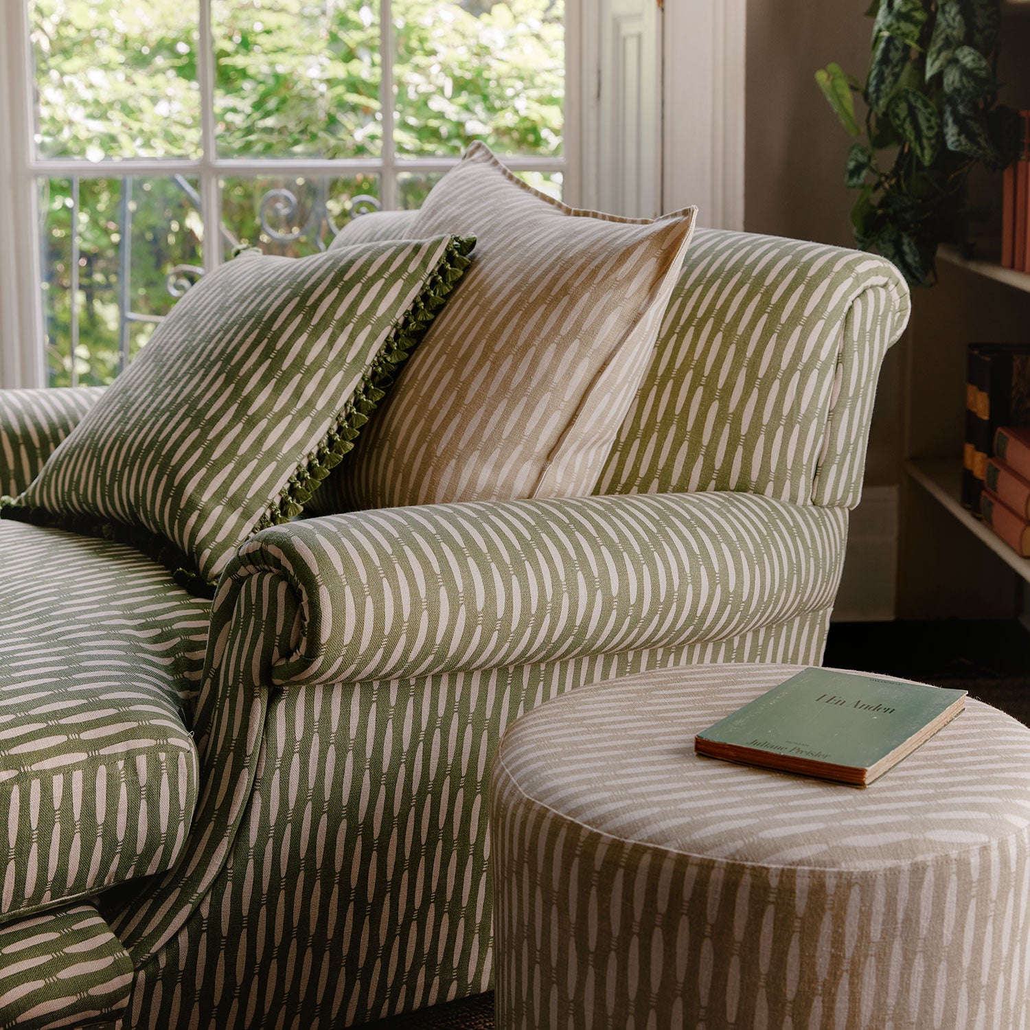 Armchair upholstered in a printed linen fabric in green and off white featuring a Japanese print.