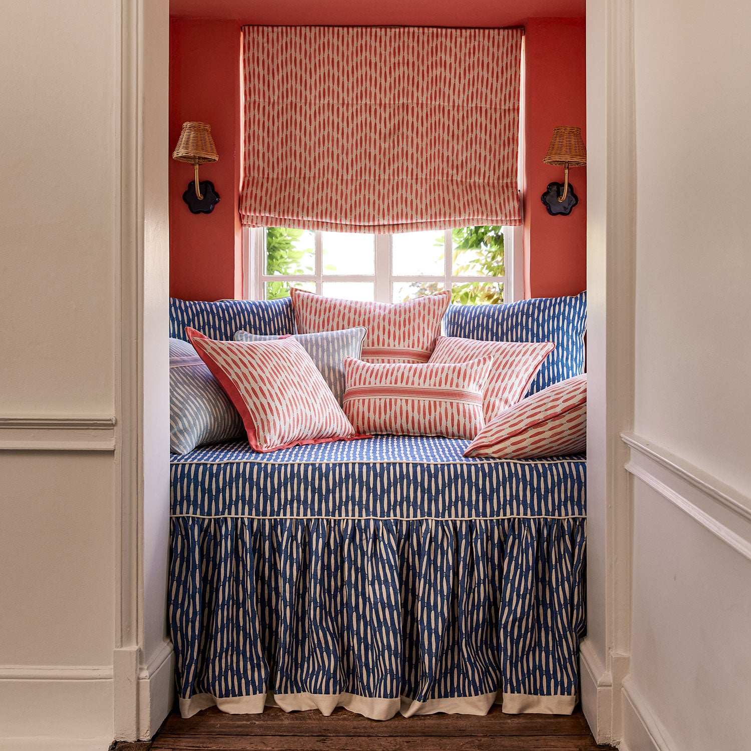 Blinds made from a printed linen fabric in orange, blue, and off white featuring a Japanese print.