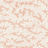 A printed linen fabric sample in pink, red and off white featuring a stylized coral pattern.