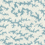 A printed linen fabric sample in blue, black and off white featuring a stylized coral pattern.