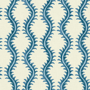 A printed linen fabric sample in blue and off white featuring a stylized fern pattern.