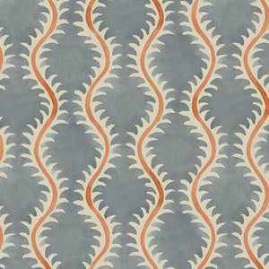 A printed linen fabric sample in blue, orange and off white featuring a stylized fern pattern.