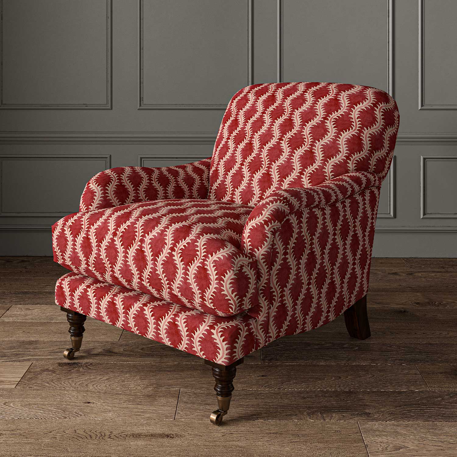 Chair upholstered in a printed linen fabric sample in red and pink featuring a stylized fern pattern.