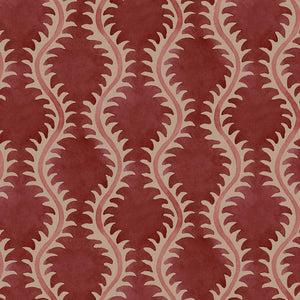 A printed linen fabric sample in red and pink featuring a stylized fern pattern.