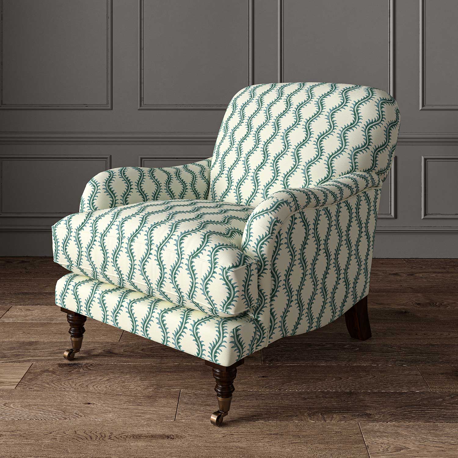 Chair upholstered in a printed linen fabric sample in blue and off white featuring a stylized fern pattern.