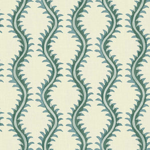 A printed linen fabric sample in blue and off white featuring a stylized fern pattern.