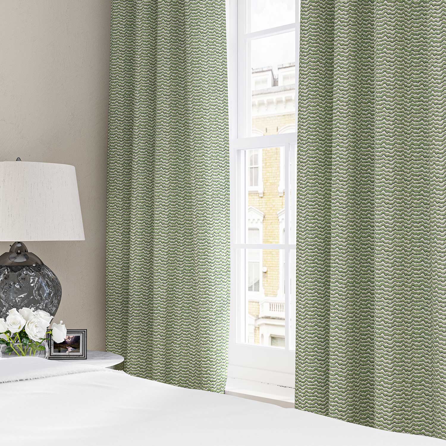 Curtains made from a printed linen fabric in green, black and off white featuring a sound wave pattern