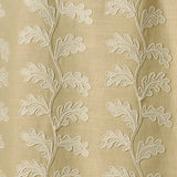 Decorative oakleaf embroidery on a beige background.