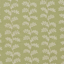 White oakleaf embroidery pattern on a green background.