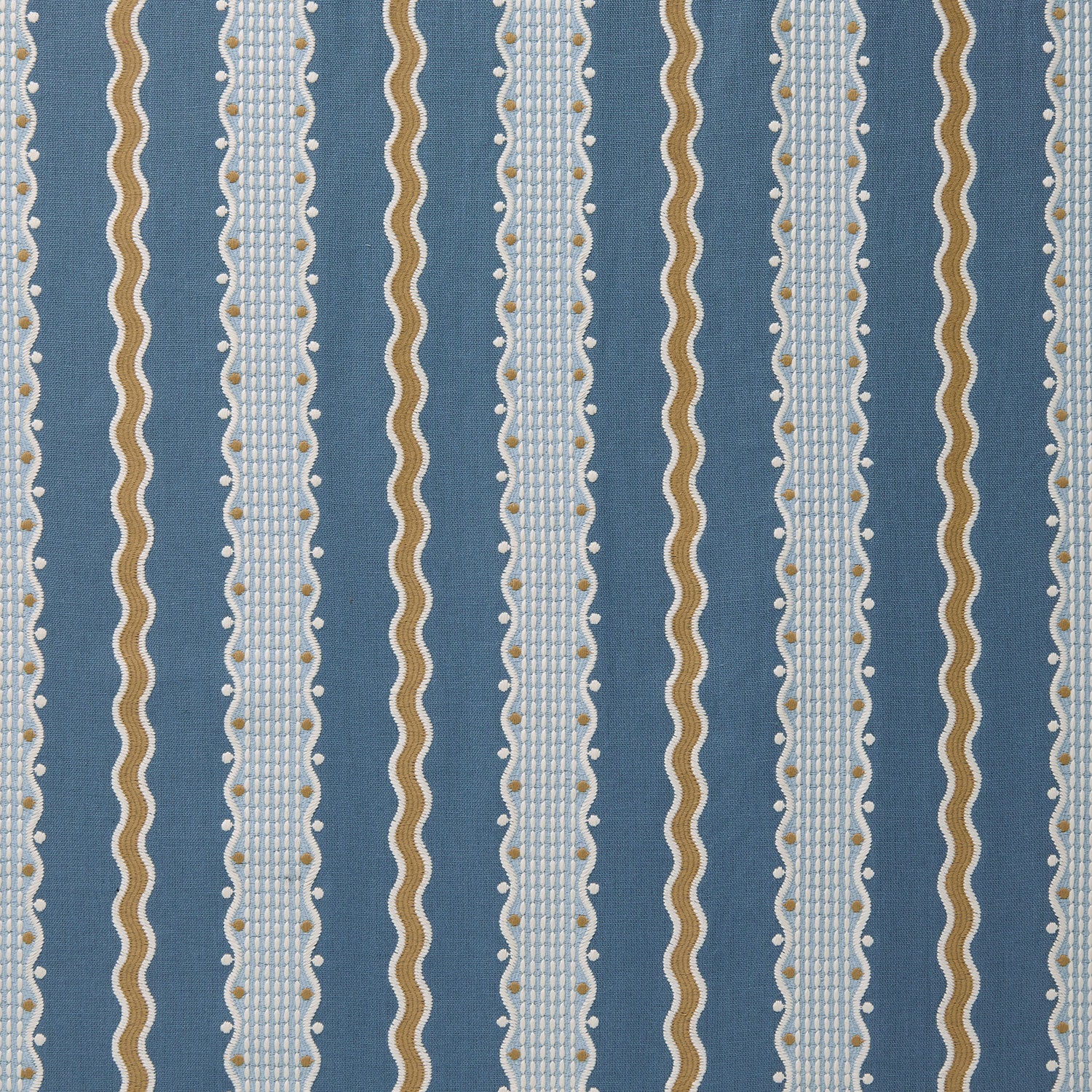 Embroidery fabric with blue, beige, and white stripes on a blue background.