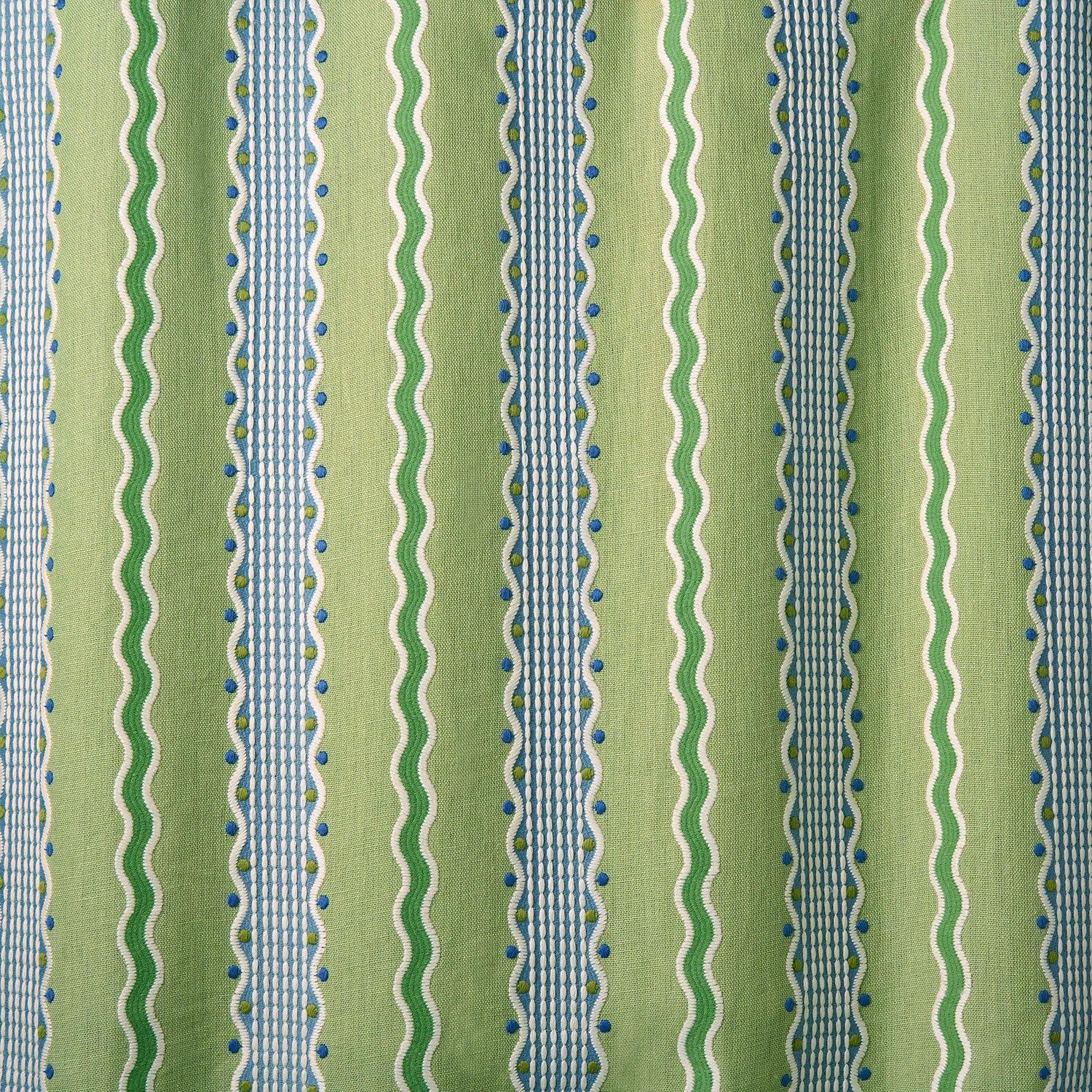 Embroidery fabric with green, blue, and white stripes on a green background.