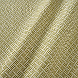 A woven fabric sample in yellow and off-white featuring a trellis pattern.