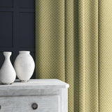 Curtain in yellow and off-white woven fabric featuring a trellis pattern.