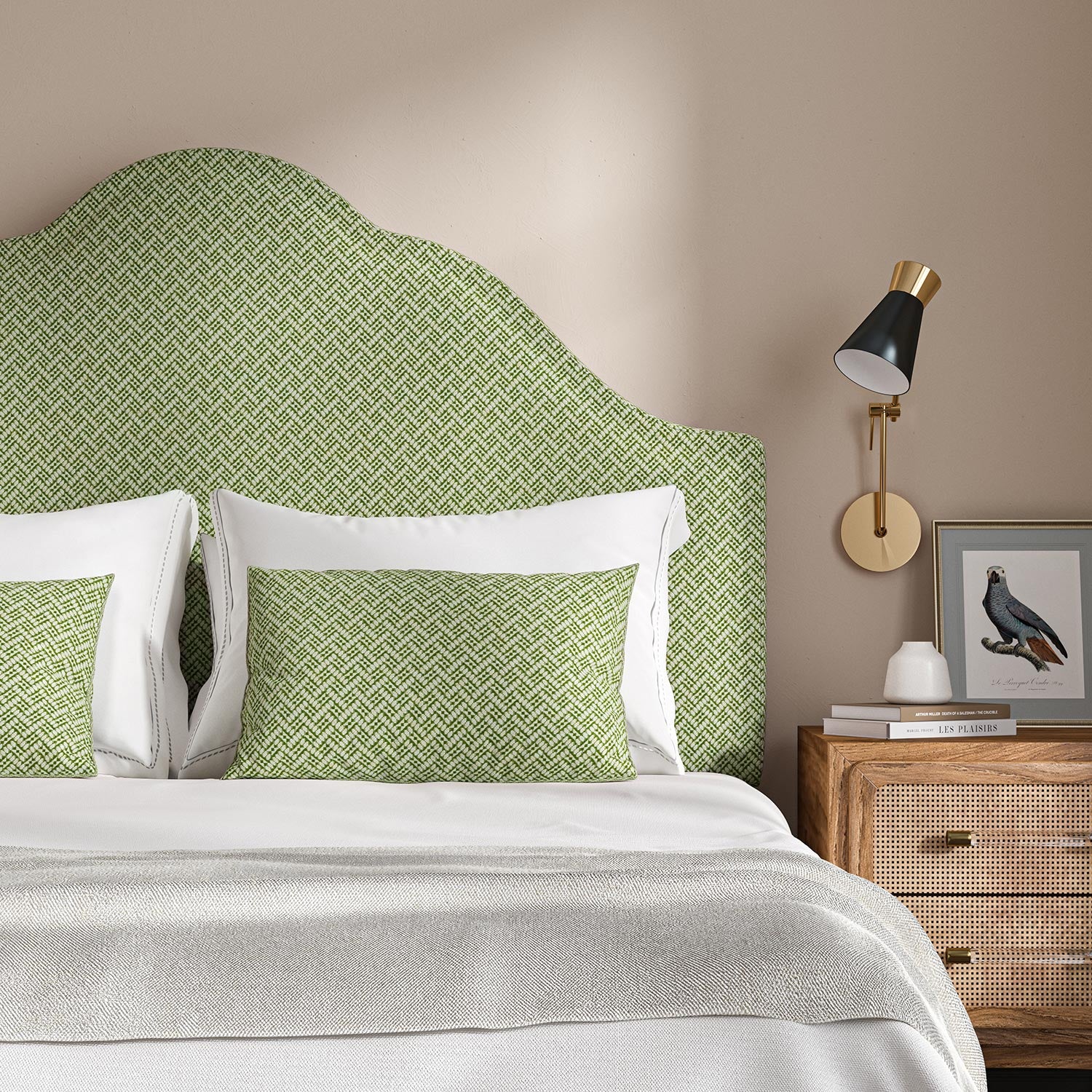 Headboard upholstered in a green and off-white woven fabric featuring a trellis pattern.