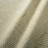 A woven fabric sample in yellow and off-white featuring a geometric pattern.