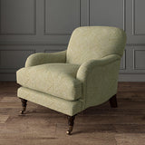 Chair upholstered in a yellow and off-white woven fabric featuring a geometric pattern.