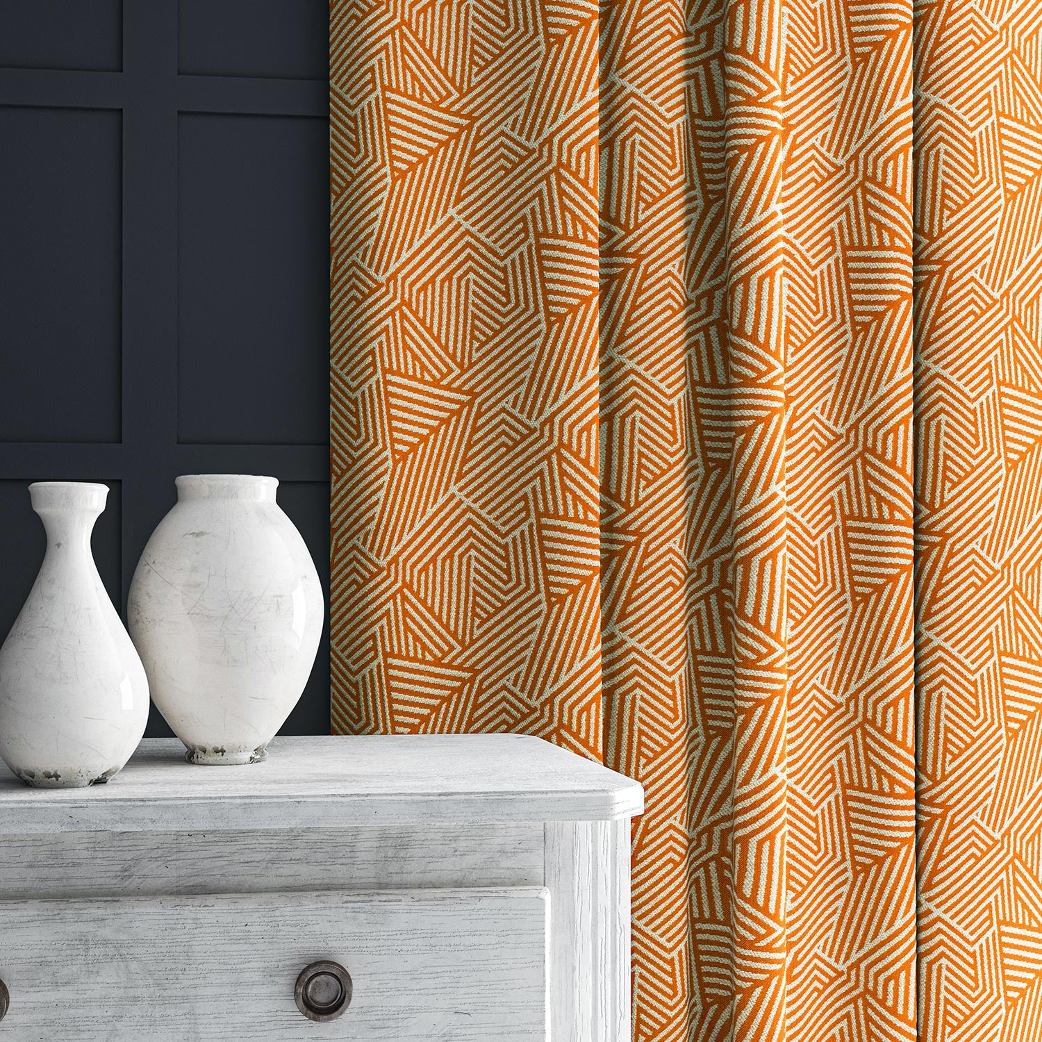 Curtain in orange and off-white woven fabric featuring a geometric pattern.