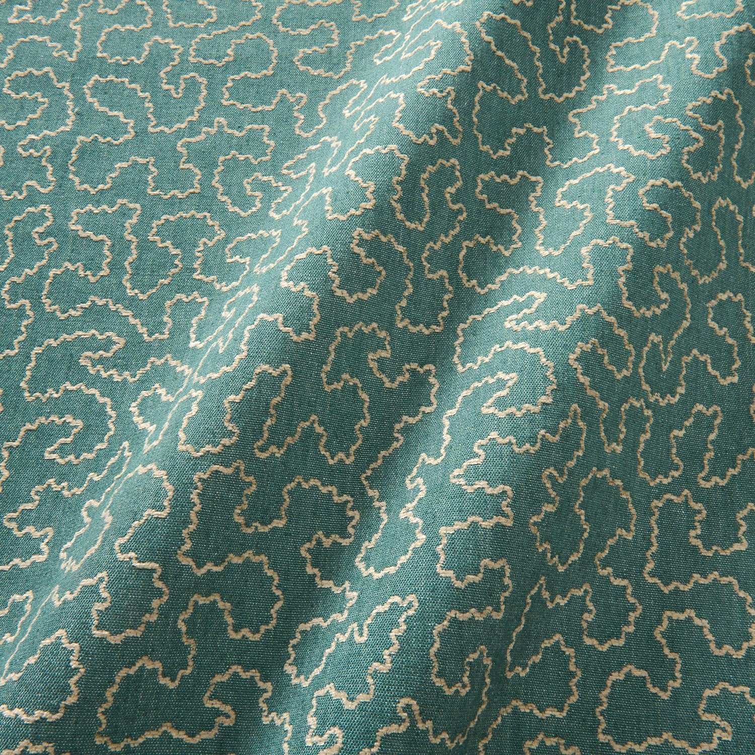 A woven fabric sample in blue and off-white featuring a wavy pattern.
