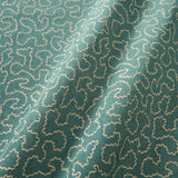 A woven fabric sample in blue and off-white featuring a wavy pattern.
