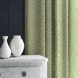 Curtain in green and off-white woven fabric featuring a wavy pattern.