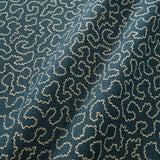 A woven fabric sample in blue and off-white featuring a wavy pattern.