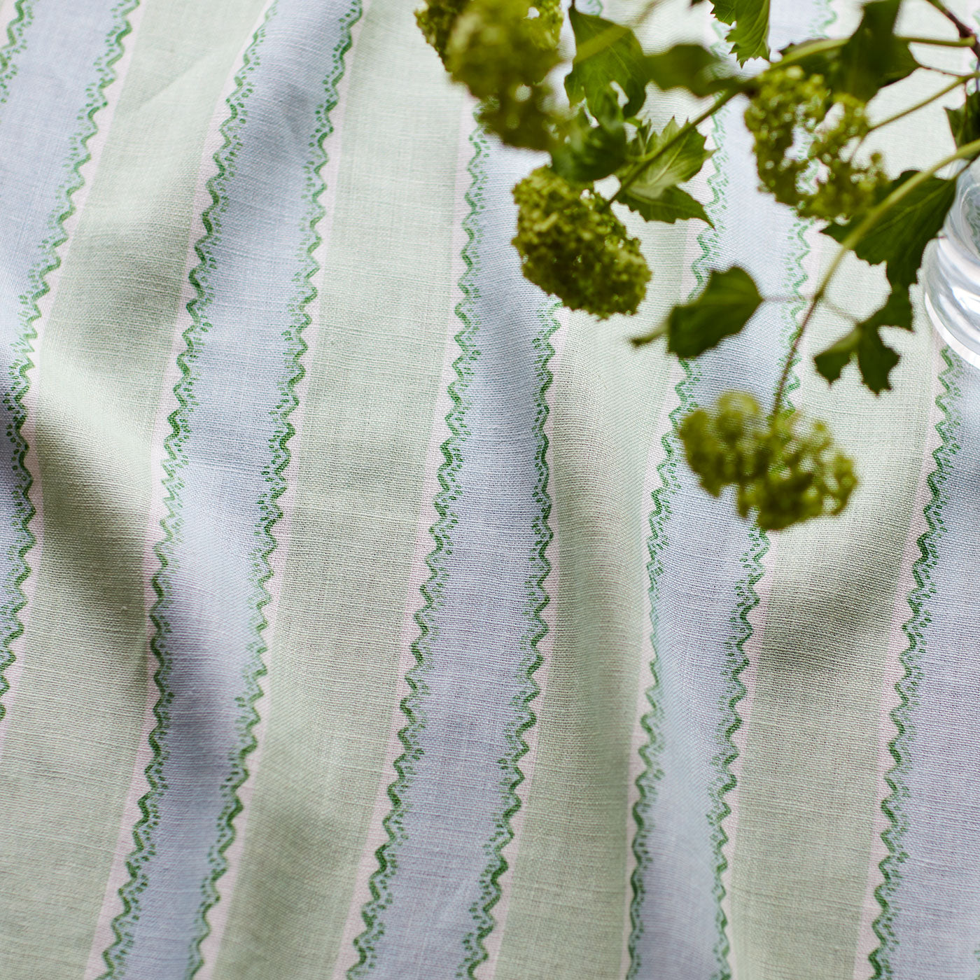 Printed linen fabric sample – a bold blocks of colour in this inviting stripe are softened with a painterly finish in blue, green and white