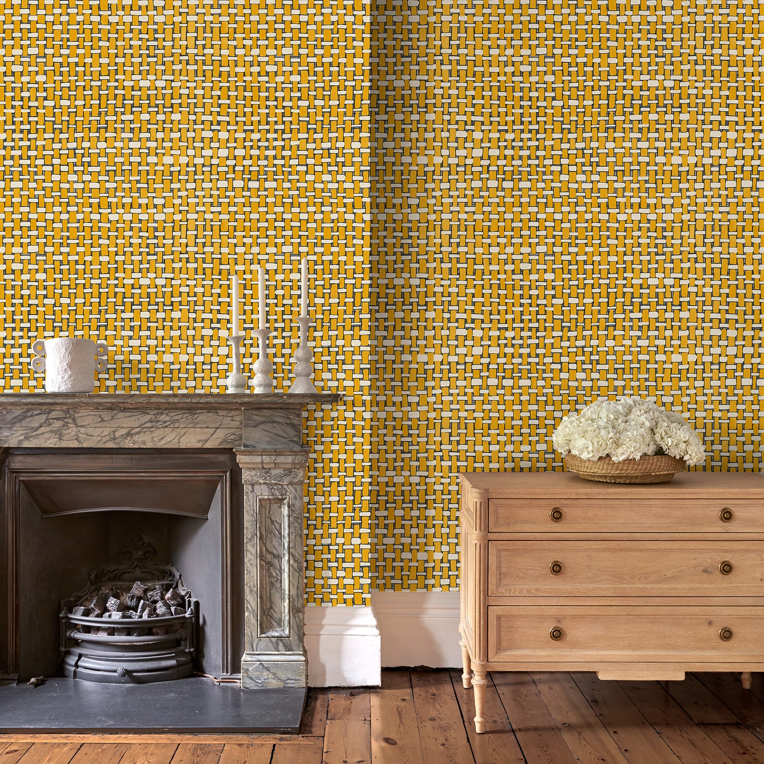 Sitting room with yellow wallpaper with faux basketweave pattern