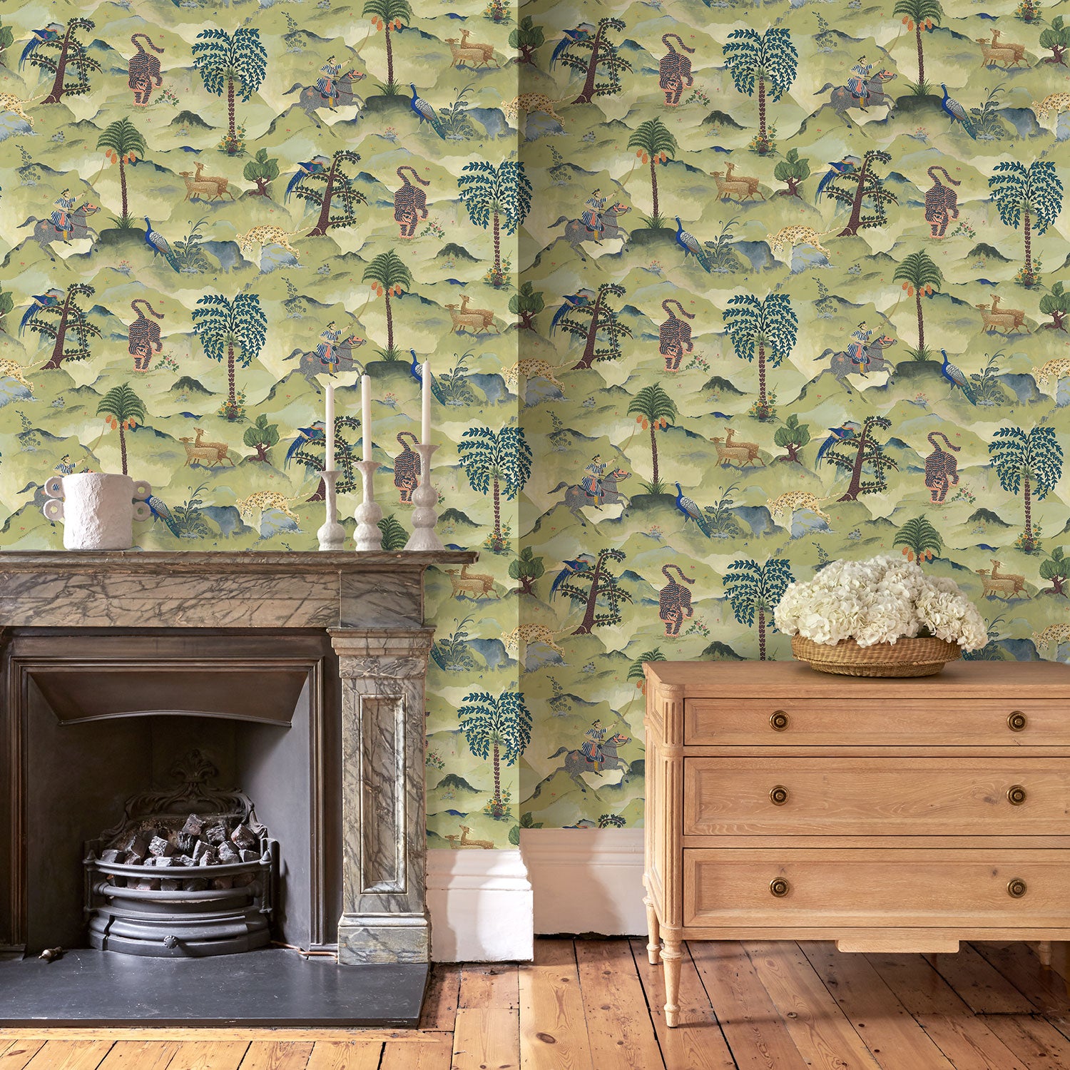 Sitting room with a tropical wallpaper featuring a mystical scenic landscape.