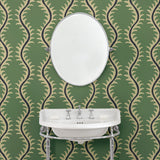 Luxurious wallpaper featuring stylised ferns and wavy lines in green and blue.