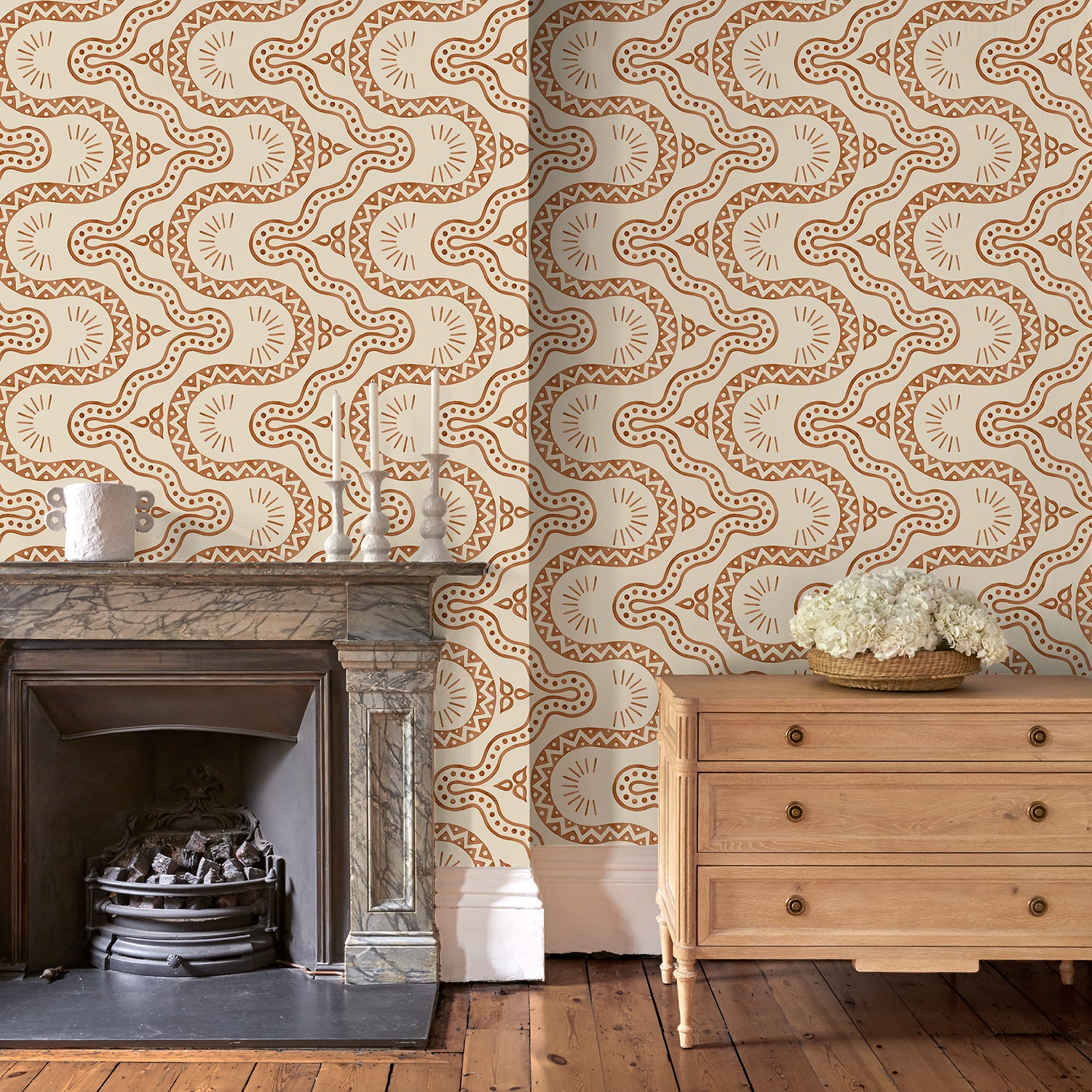 Sitting room with a brown geometric wallpaper.