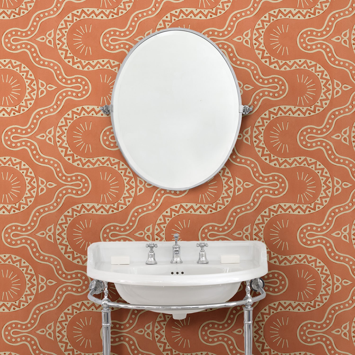Cloakroom with a orange geometric wallpaper.