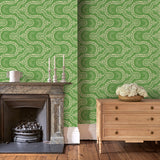 Sitting room with a green geometric wallpaper.