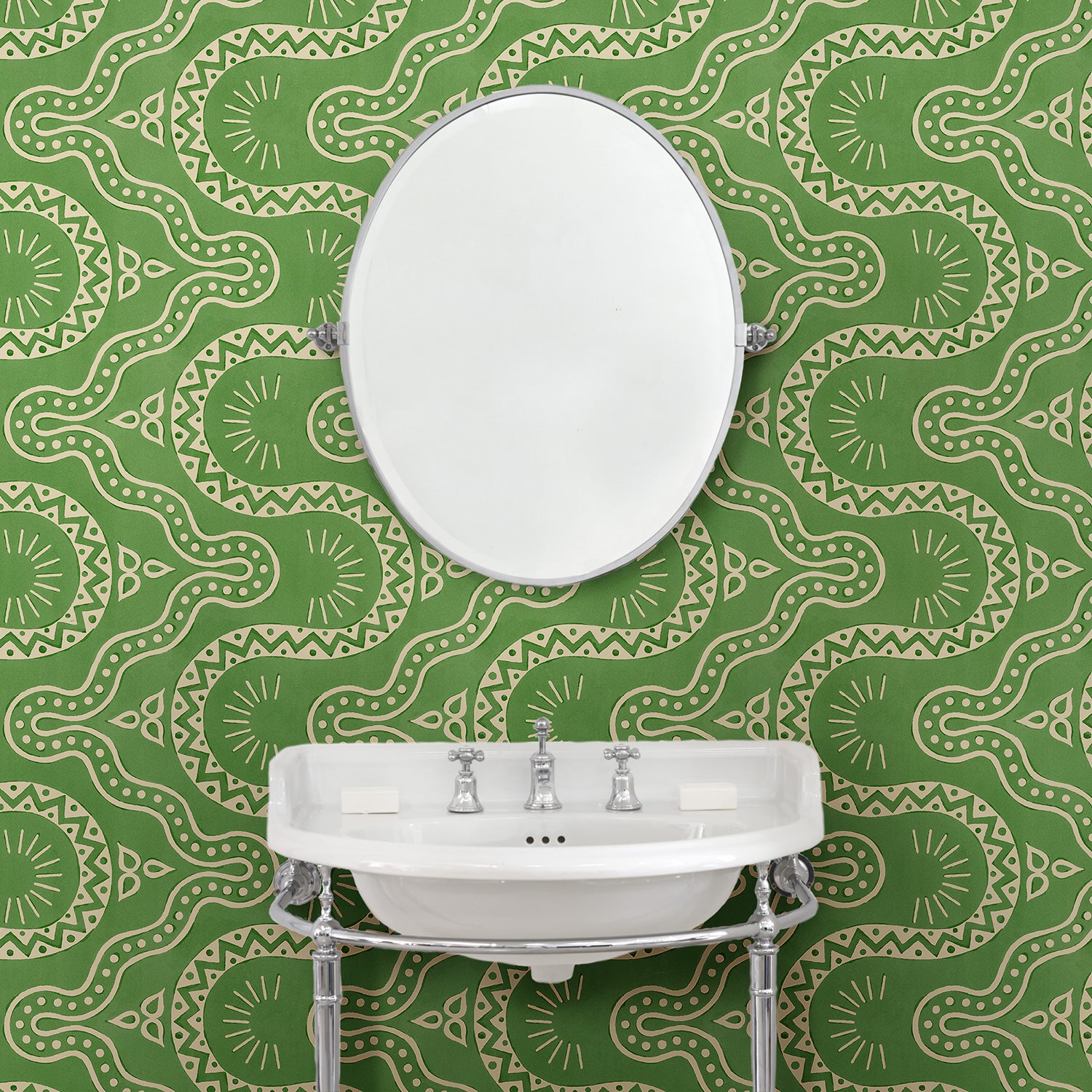 Cloakoom with a green geometric wallpaper.
