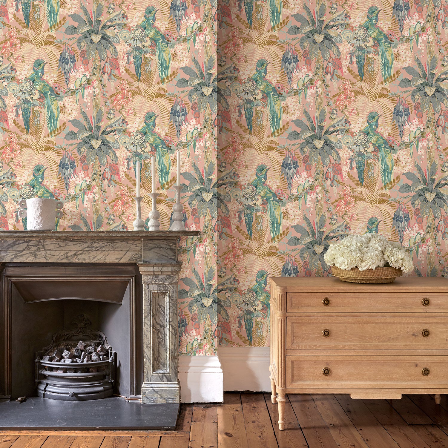 Tropical wallpaper in candy, shown in a sitting room.