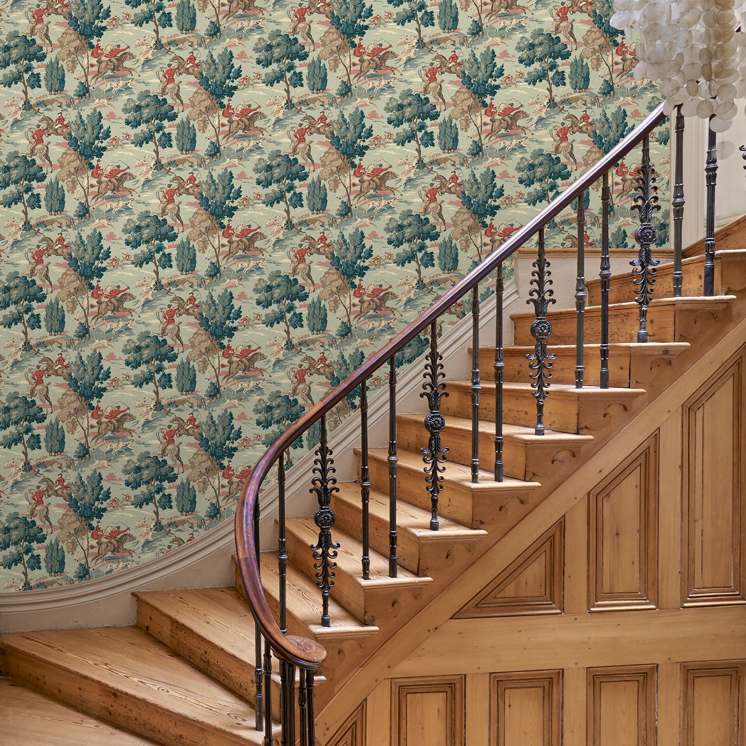Hall showcasing a designer wallpaper featuring the British hunt.