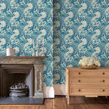 Sitting room with stylish abstract wallpaper featuring dramatic, undulating waves.