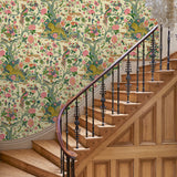 Presented in a fresh, inviting colour palette, this designer wallpaper features parrots, lions and exotic flowers.