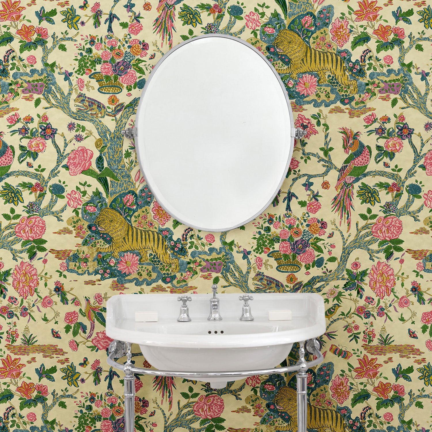 Presented in a fresh, inviting colour palette, this designer wallpaper features parrots, lions and exotic flowers.
