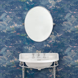 Cloakroom featuring a painterly-style blue wallpaper.