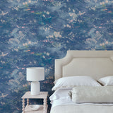Sitting room featuring a painterly-style blue wallpaper.