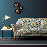 Sofa covered in a floral-style printed velvet fabric.