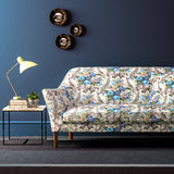 Sofa upholstered in a velvet upholstery fabric with stain resistant finish and vibrant colourful flower bouquet