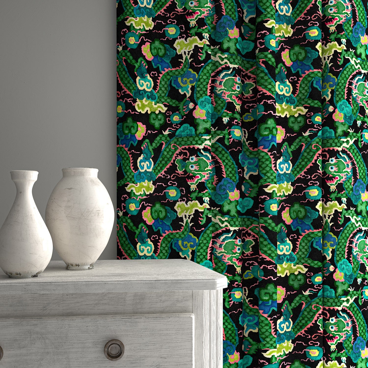 Velvet curtains upholstered in a printed velvet fabric with a intricate mirror dragon design in green colours.