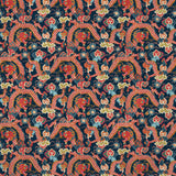 Printed velvet fabric with intricate mirror dragon design in orange and blue colours, for upholstery and curtain use.
